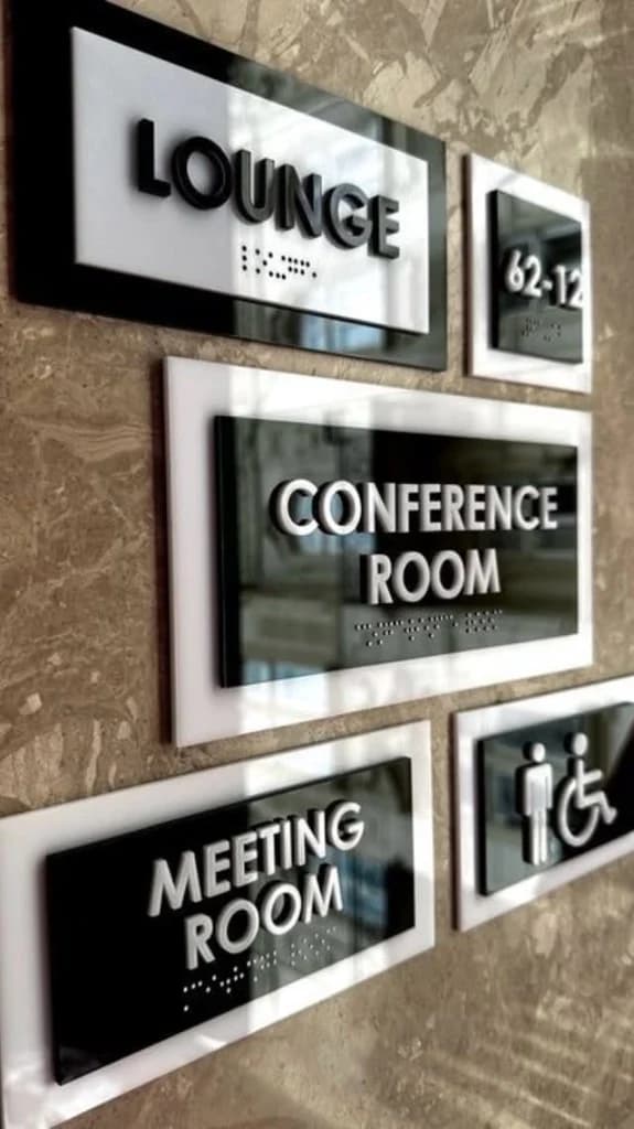 Conference room, lounge, and meeting room name plates with Braille